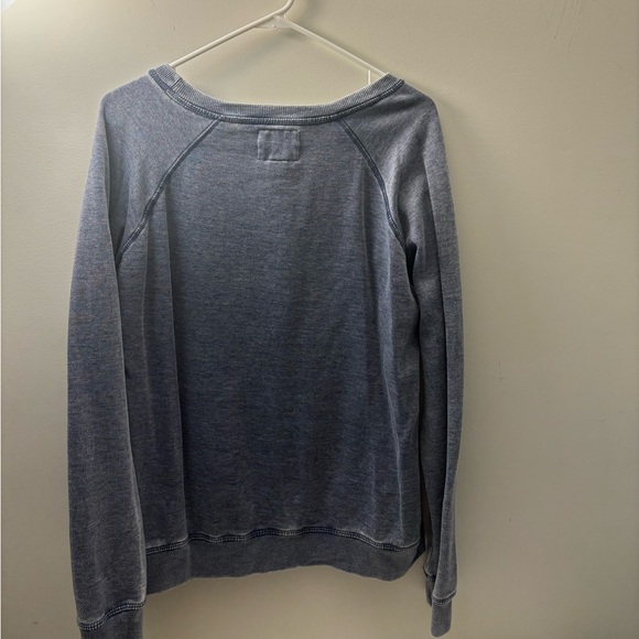 A comfortable blue sweater that will keep you warm on late summer nights - Picture 2 of 3